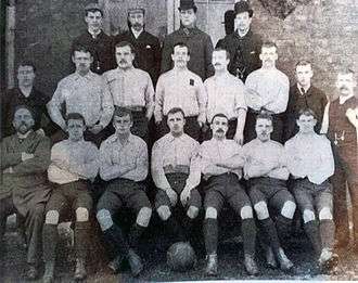 1891-92 Sheffield United F.C. first team. Pictured (left to right) – Rear: Fred Davies, Harry Stones (assistant secretary), John Scott, Will Lilley Middle: W. Patterson, Rab Howell, Bob Cain, Charlie Howlett, Billy Hendry, Harry Lilley, W. Nesbitt, Fred Housley (trainer) Front: Charles Stokes (football committee chairman), Sandy Wallace, Samuel Dobson, Harry Hammond (footballer)