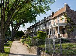 Rowhouses set back uniformly from the street