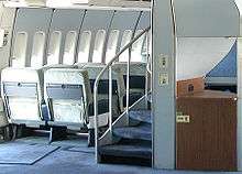 A helical staircase on 747-100s and -200s that leads to the upper deck