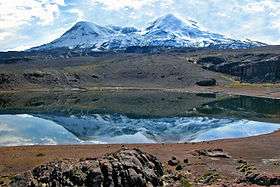 View on two summit mountain from over a lake