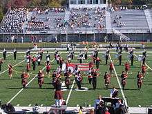 Edinboro University Pipers with Marching Band at Football Homecoming