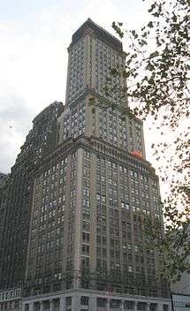 Montague-Court Building, a high-rise building clad in stone, viewed from street level