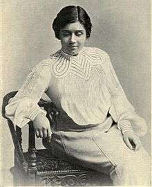 Photograph of Olive Christian Malvery sitting in a chair