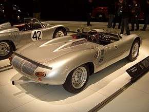 A rear three-quarters view of a silver W-RS