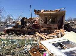 An image depicting the remains of a destroyed double-wide mobile home in Sand Springs, Oklhoma.