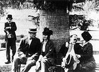 Chaplin looking at the happy couples.